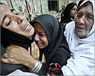 Relatives of Ghadir Mukhaimar grieve at her funeral 