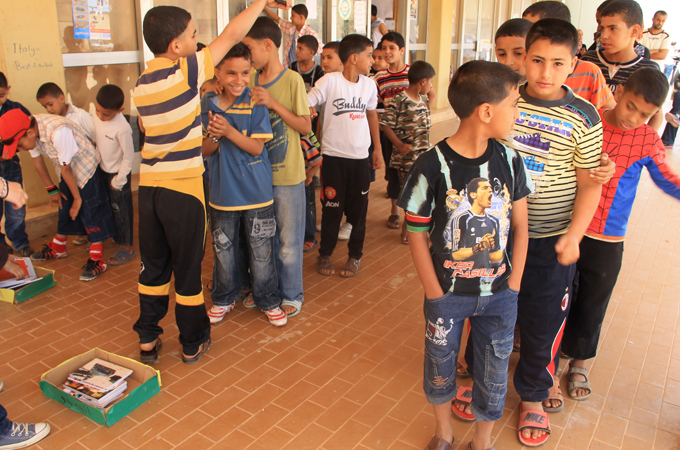 This is the third and final image which shows children taking part in a UNICEF-supported workshop aimed at raising awareness of unexploded remnants of war in a Benghazi camp.