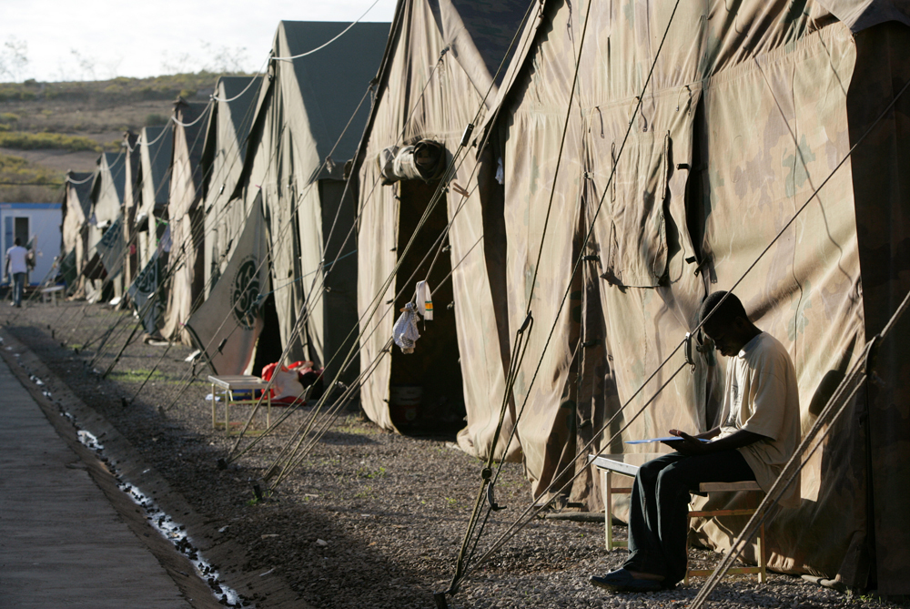 An African migrant is seen at the CETI, Short Stay Immigrant Center