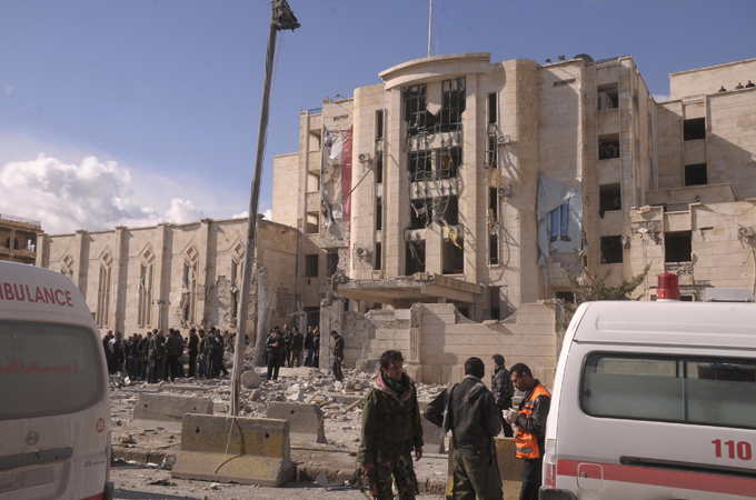 Syrian security personnel inspect the site of an explosion in Syria''s northern city of Aleppo February 10, 2012. Twenty-five people were killed and 175 people were wounded in two blasts targeting security bases in Aleppo on Friday, state television quoted the Health Ministry as saying. REUTERS