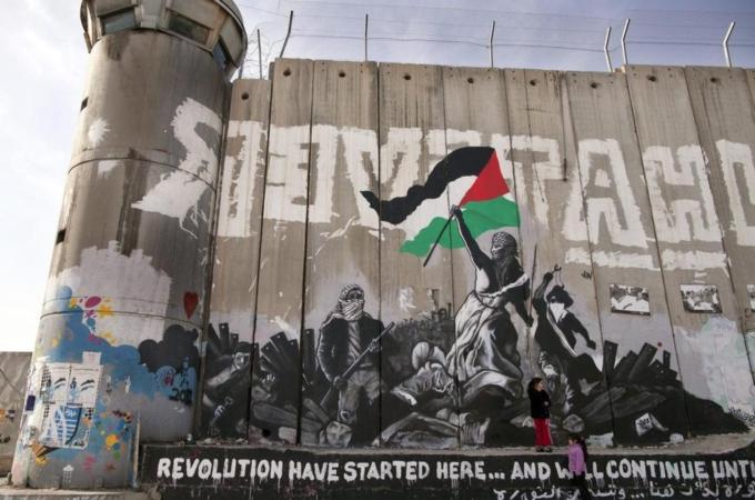 Palestinian graffiti painting on separation wall in Bethlehem