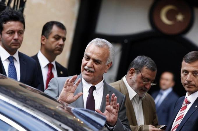 Iraq''s fugitive Vice President Tareq al-Hashemi gestures as he leaves a meeting in Ankara