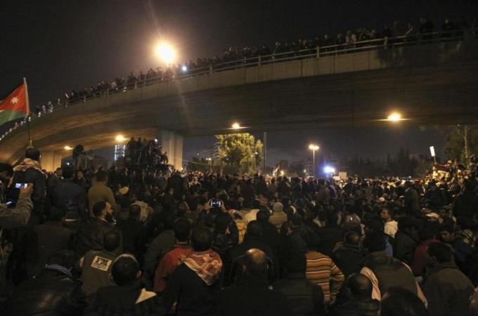 Protesters take part during a demonstration following an announcement that Jordan would raise fuel prices, including hike on cooking gas, in Amman