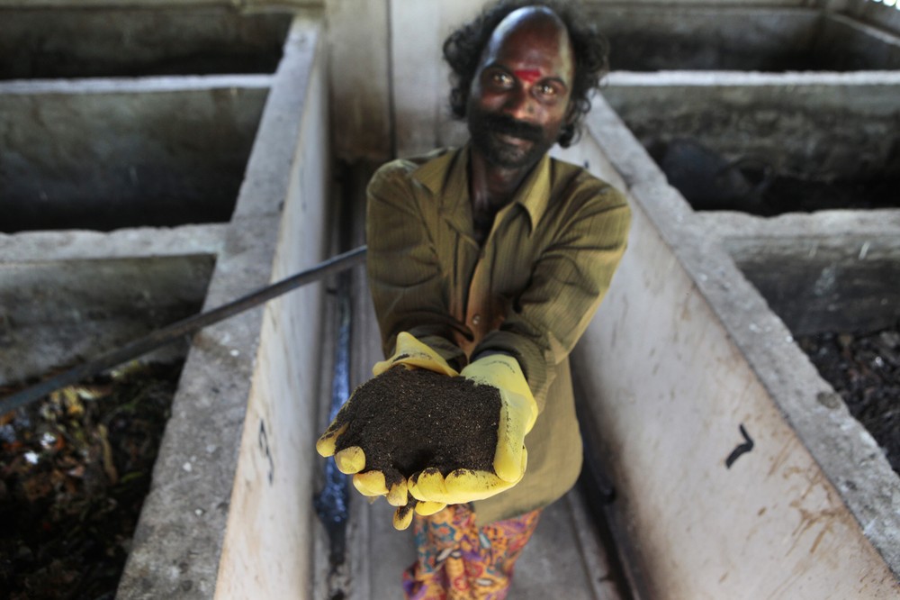 Waste collector, Varghese, holds a handful of compost at the compost site, at Chinnavilai village, India.It is estimated that around 2.5bn people around the world lack access to safe sanitation. 
