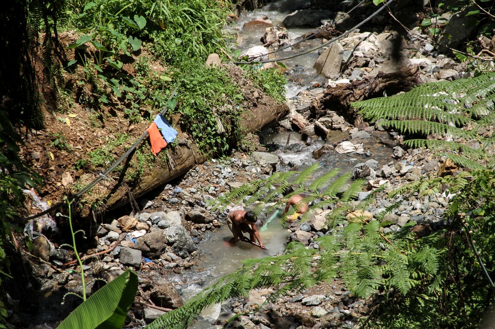 Children search for gold left over from small-scale mining projects in the Compostela Valley, located in the Davao Region of Mindanao in the southern Philippines. About one-third of Filipinos live under the poverty line, and many experience underemployment.