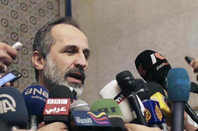 File photo of Syrian National Coalition leader Moaz Alkhatib speaking to the media in Cairo