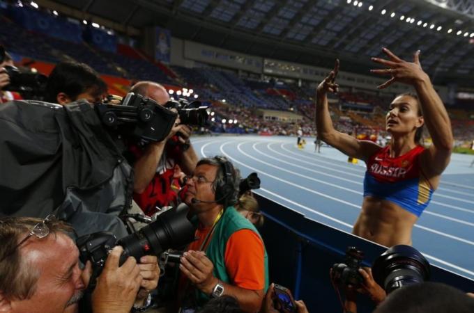 Isinbayeva of Russia celebrates after winning women''s pole vault final at World Athletics Championships in Moscow
