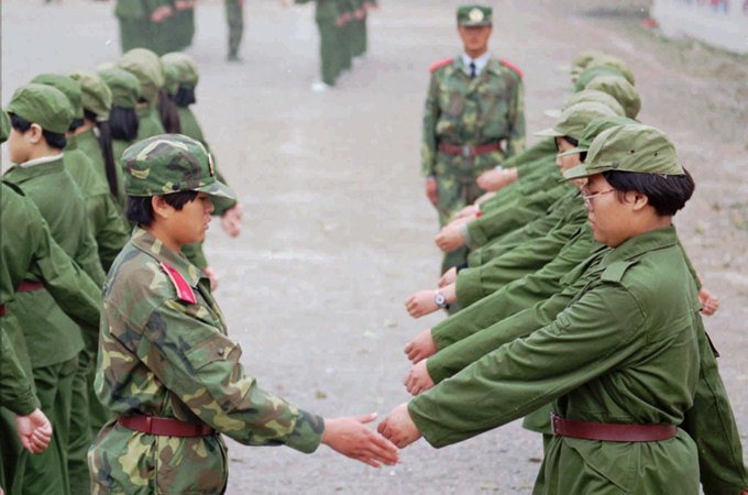 Newly enrolled students must take part in brief military training exercises, but some question its value [AP]