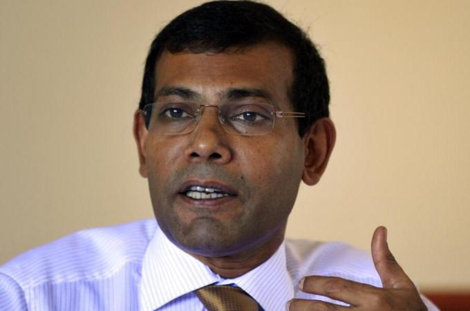 "Nasheed’s journey from a Maldivian torture cell to global statesman is the stuff movies are made of," write Lykke Friis and Anders Henriksen. [AP]