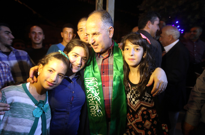 Palestinian prisoner Jamil Nabi Annatsheh is welcomed by his relatives in Hebron in August 2013 [EPA]