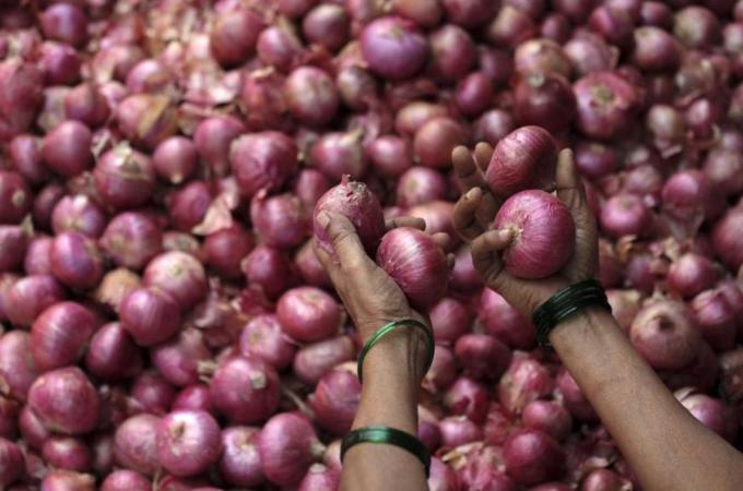 Retail prices of politically sensitive onions have risen four times in the last three months [EPA]