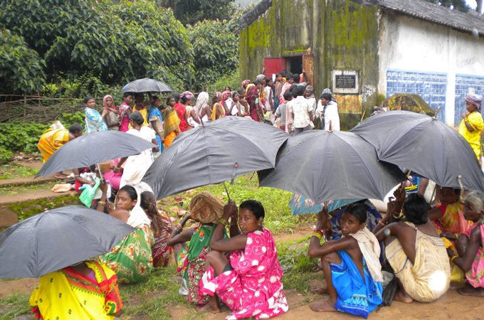 Women waiting in front of a ration shop in Koraput, India [Mihika Chatterjee]