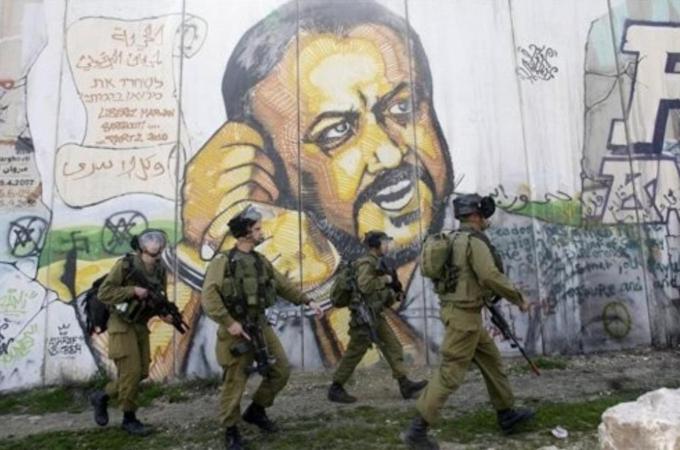 Serving five life sentences behind Israeli jail, Barghouti may yet succeed Mahmoud Abbas as president [AP]