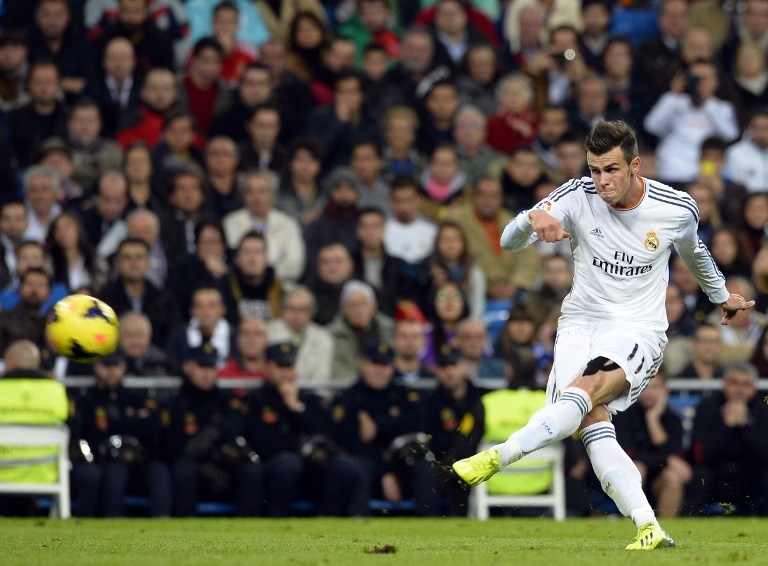 The world's most expensive footballer Gareth Bale scores his second goal for Real Madrid against Sevilla FC [AFP]