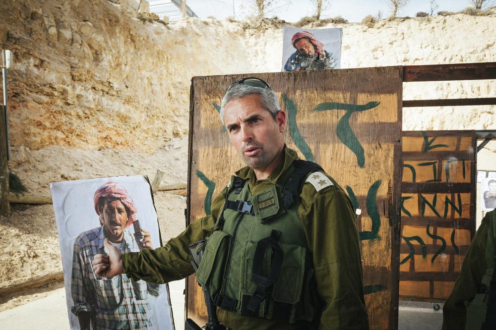 Sharon Gat, the CEO and founder of Caliber 3, explains to a group of tourists: "Even if the targets are Arabs and they don(***)t like Jews, we don(***)t shoot people that are not intended to make a terrorist act."