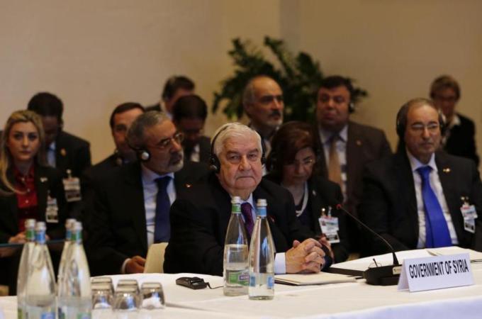 Syria's Foreign Minister Walid Muallem leads his delegation at the opening of the Geneva II peace conference [Reuters]