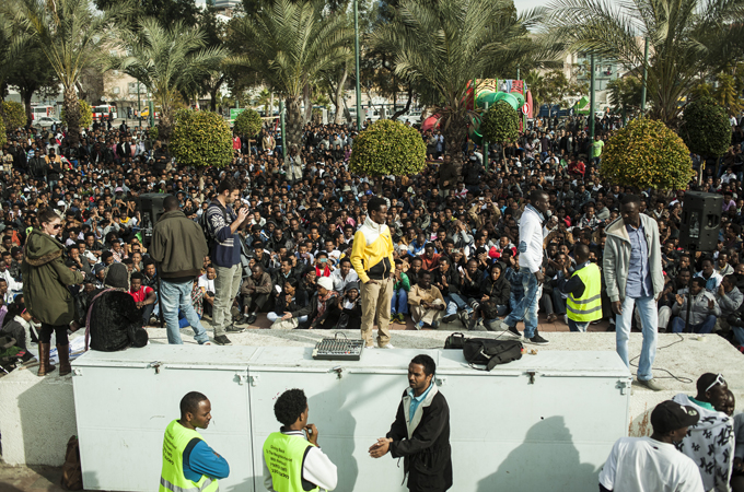 Thousands of asylum seekers are protesting against harsh penalties levelled at those crossing the border without a permit [Eduardo Soretas/Al Jazeera]