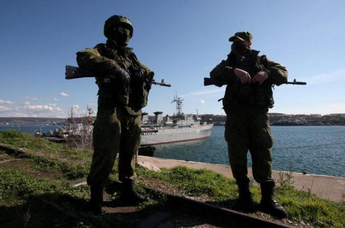 It is increasingly clear that the armed 'green men' in Crimea are Russian soldiers, writes the author [EPA]