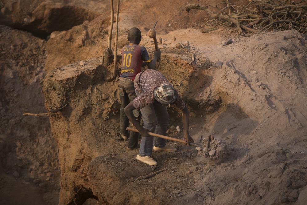 <p>Two young boys dig pits at an artisanal gold mining site in southern Mali. Their fathers also work at the mines. Many parents encourage their children to work in order to contribute to household finances. </p>
