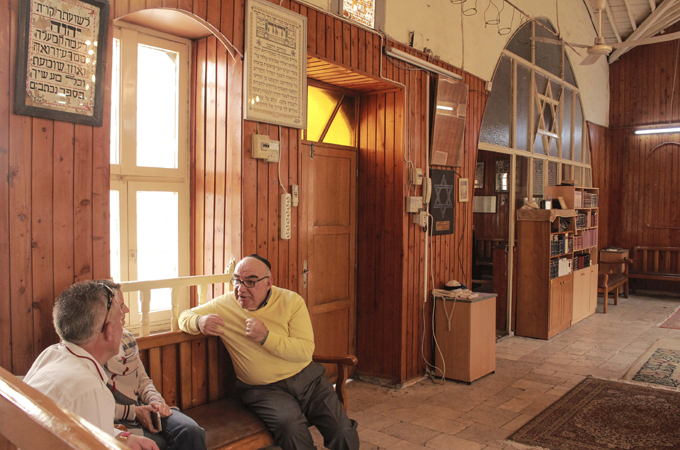 Synagogue caretaker Harun Cemal, 60, gives tours to visitors in Antakya [Danya Chudacoff/Al Jazeera]