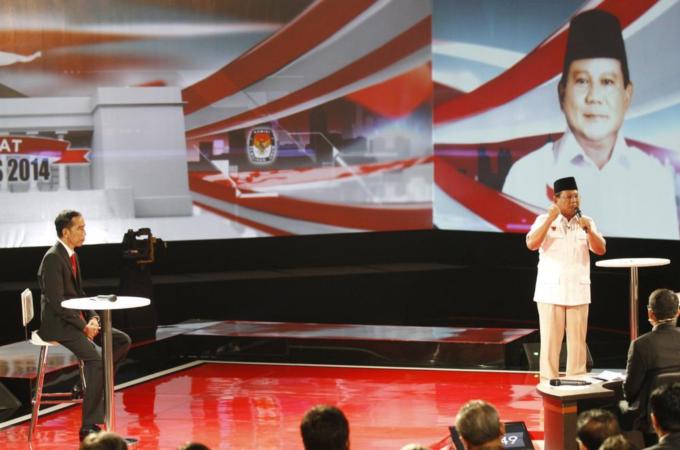 Neither candidate in Indonesia's presidential race has suggested rescinding bans on political parties [AP]