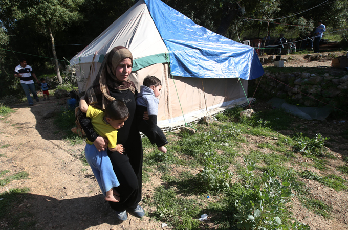 In many cases, Syrian women have become the primary breadwinners for their families in Lebanon [AP]
