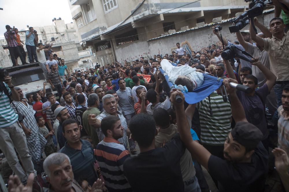 Palestinian mourners carry the bodies of the three children from the Shuhaibar family, killed in an Israeli airstrike in the Sabra neighbourhood of Gaza City on Thursday.
