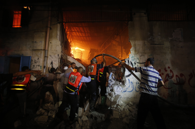 Palestinians say about 60,000 people have lost their jobs after Israel destroyed several Gaza factories. [AP]