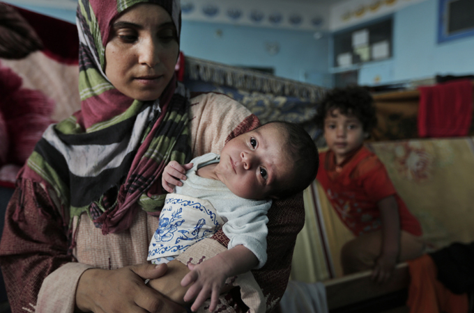 Many women have been forced to give birth at home or at shelters as hospitals in Gaza have been damaged [AP]