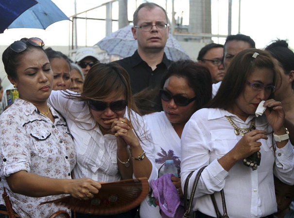 Jeffrey 'Jennifer' Laude's family and German fiance mourn during a funeral procession on Friday [AP]
