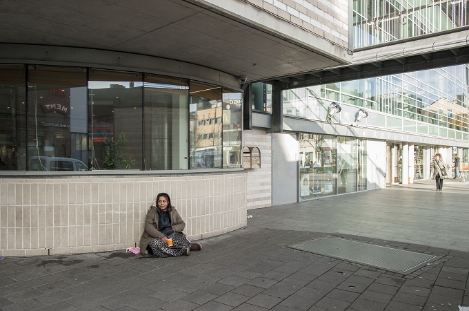 Margel Nikoleta begs for change in the main square of Arendal, a town of 40,000 [Anne Lise Jensen/Al Jazeera]