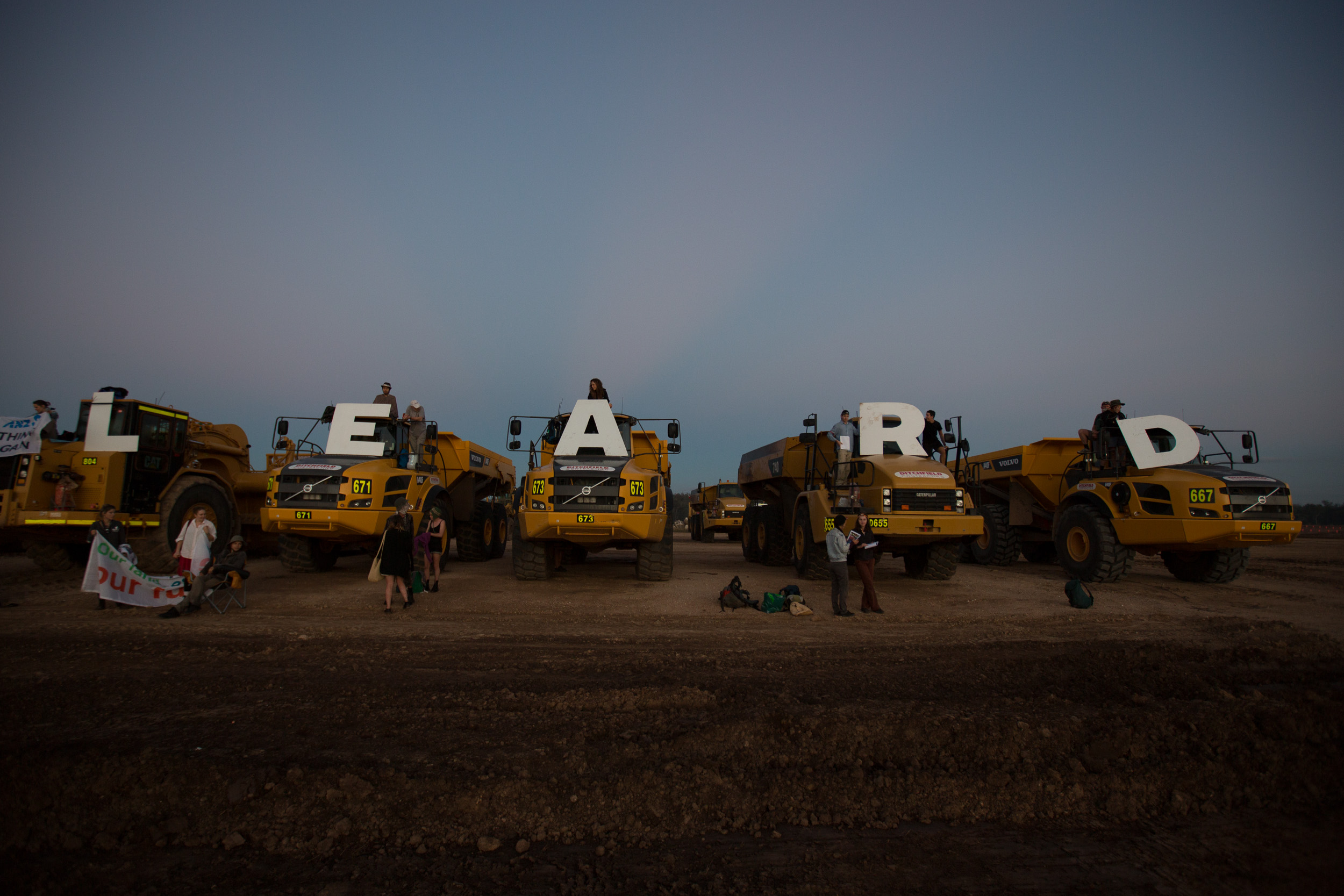 Protesters chain themselves to mining equipment to block a new mine project [Greenpeace/Leard Forest Alliance]