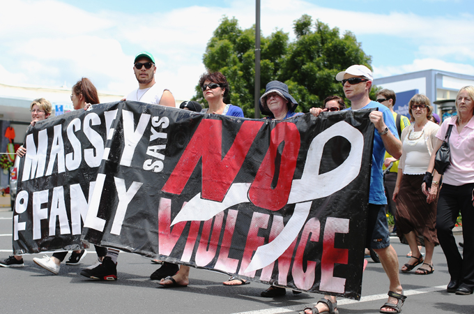 Protesters marched on November 25, 2013 raising awareness about rising abuse rates [H. Johnston/Getty Images]