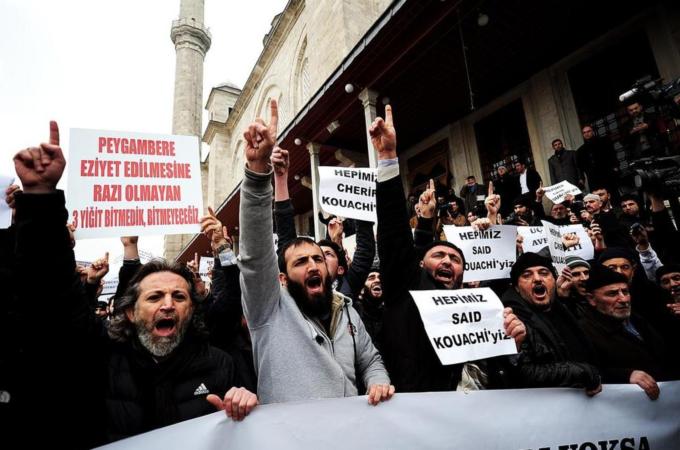 Turkish anti-Charlie Hebdo protesters shout slogans and hold placards reading 'We are all Kouachi' [AFP]