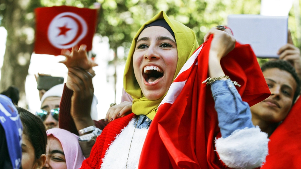 A woman shouts slogans during celebrations marking the fourth anniversary of Tunisia''s 2011 revolution, in Tunis