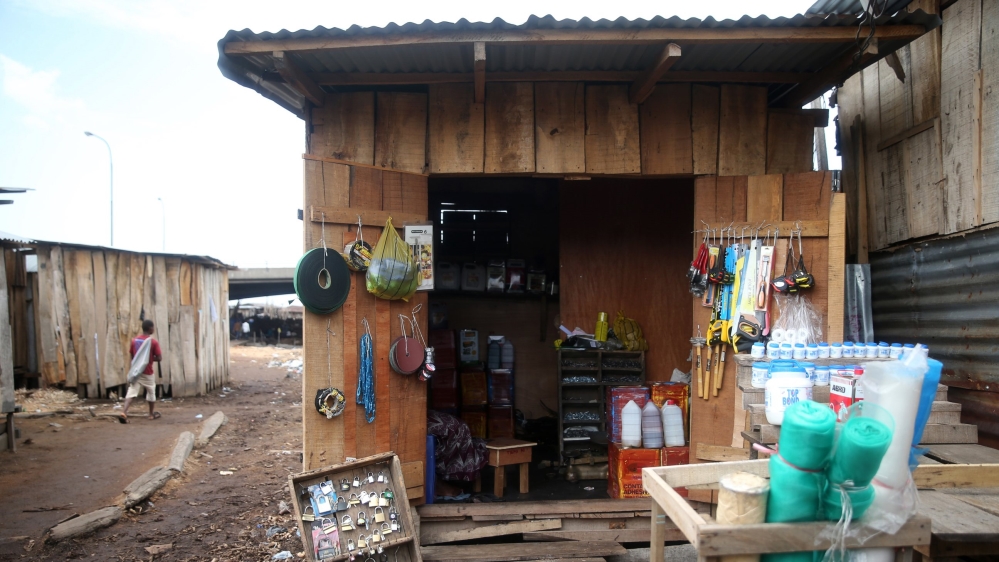 A shop built from planks, where carpentry hardware is sold, is seen at Okobaba sawmill at the edge of the Lagos Lagoon