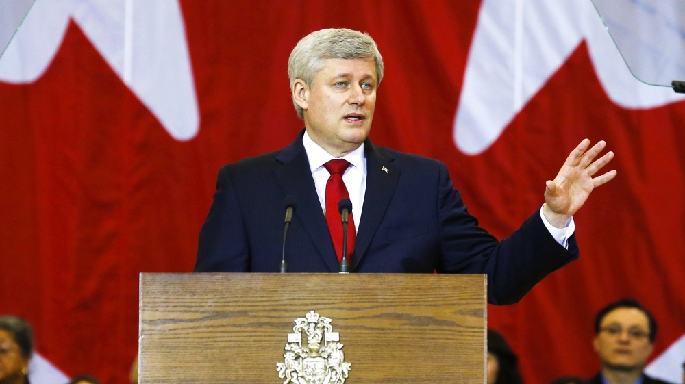 Canadian PM Harper speaks at a news conference in Richmond Hill
