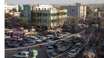 Busy street life in the Somaliland capital, Hargeisa, where khat stalls line the streets [James Jeffrey/Al Jazeera]