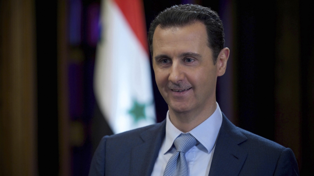 Syria''s President Bashar al-Assad is seen during the filming of an interview with the BBC, in Damascus