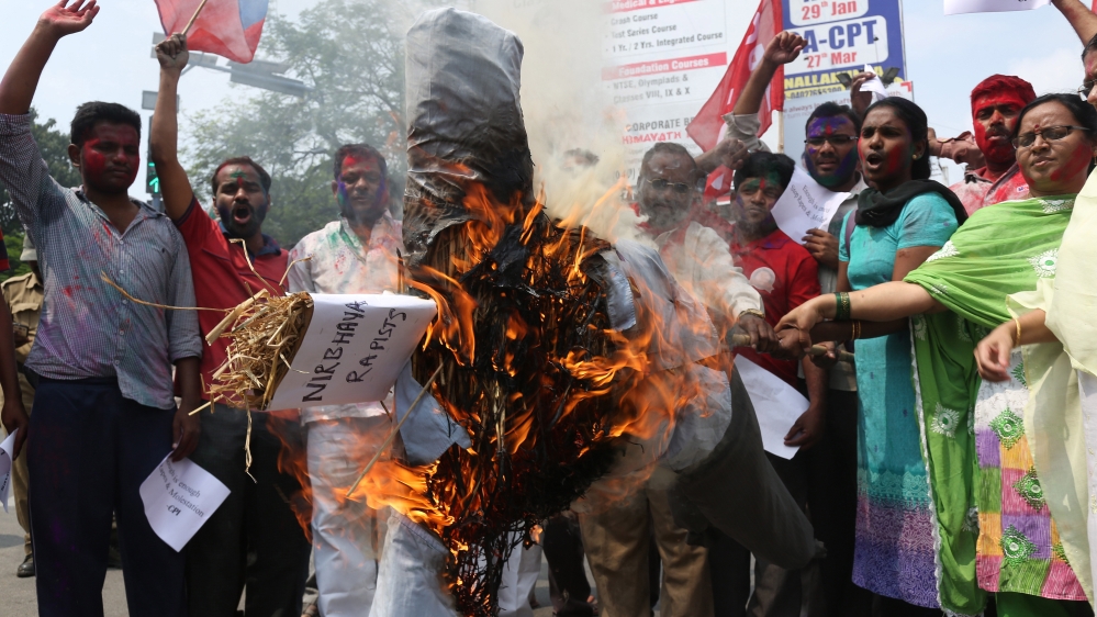 Activists burn an effigy representing the rapists convicted in the gang rape in a moving bus in New Delhi, in Hyderabad, India [AP]