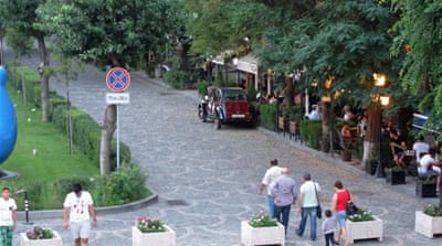 Summer cafes line the streets of Yerevan [Al Jazeera]