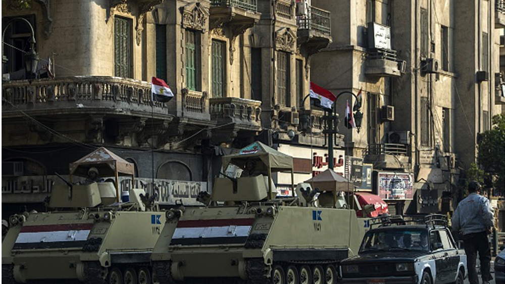Egyptian army armoured personnel carriers parked in Cairo''s Tahrir Square in November 2014 [Getty]