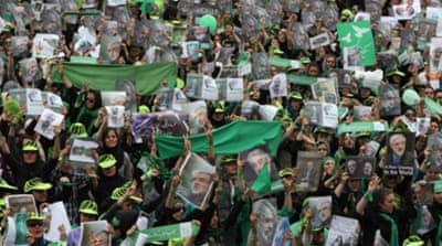 Supporters of Iranian presidential candidate Mir Hossein Mousavi wave green flags in June 2009 [AFP]