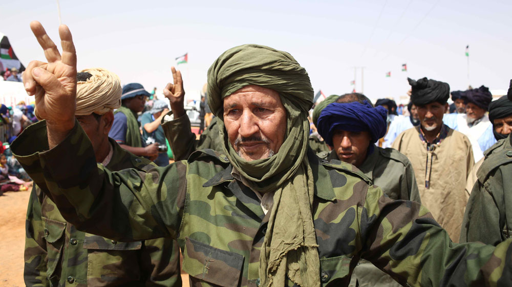 Sahrawi refugees on the sand dunes of a desert party put on during the FiSahara film festival [Hannah McNeish/Al Jazeera]