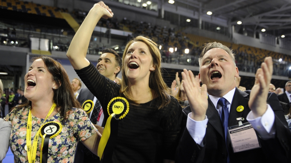 Scottish National Party supporters react to election results at the Glasgow election count in Glasgow [AFP]