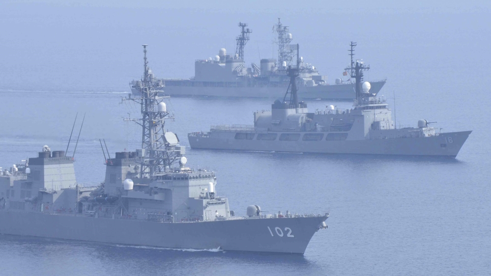 Japanese Maritime Self-Defence Force''s destroyers Harusame and Amagiri sail side by side with Philippine warship BRP Ramon Alcaraz as they make a formation during their joint naval drill in South Chin