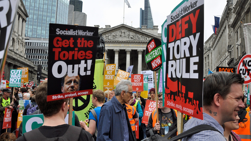 Marchers carried banners and placards reading: 'They cut, we bleed' and 'Homes not Trident', a reference to the UK's nuclear deterrent [Simon Hooper/Al Jazeera]