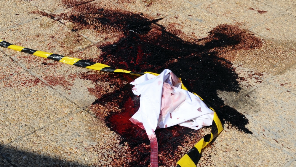 Blood and material on the ground near the area where an attack took place in Tunisia [AP]