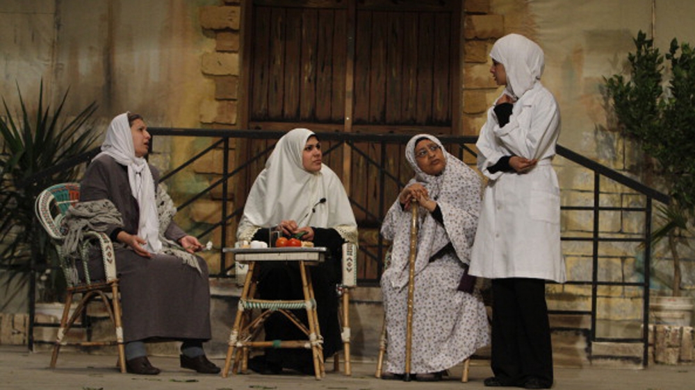 Palestinian women perform in a play on stage in Gaza City in 2012 [AFP]