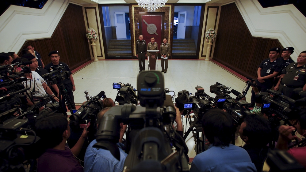 Thai national police chief Somyot addresses the media after Lieutenant General Manus turned himself in at the National Police Headquarters in Bangkok